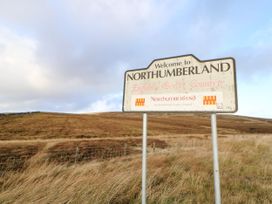 A welcome sign for Northumberland in the countryside