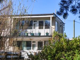 A building with balcony and plants at Flat 1 Lee Cliff Park Dawlish Warren