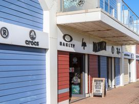 A storefront displaying Crocs and Oakley at Flat 1 Lee Cliff Park Dawlish Warren