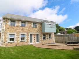 A house with windows and a patio at Rosevale Villa in St Ives