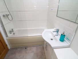 A bathroom with a bathtub and sink at Rosevale Villa St Ives