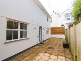 An outdoor area with patio and house exterior at Rosevale Villa St Ives