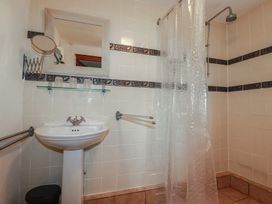 A bathroom with a sink and shower at Plenteth in Truro