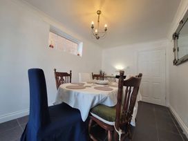 A dining room with a table and chairs at 16 Forth An Nance, Portreath