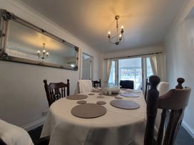 A dining room with a table and chairs at 16 Forth An Nance, Portreath