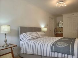 A bedroom with a bed and nightstand at 16 Forth An Nance in Portreath