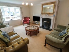 A living room with sofas and a coffee table at 16 Forth An Nance in Portreath