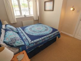A bedroom with a bed and window at 16 Forth An Nance Portreath