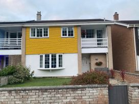 A house with multiple windows and a balcony at 16 Forth An Nance Portreath
