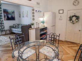 A dining room with a glass table and chairs at 55 Meldon terrace Newbiggin-by-the-Sea
