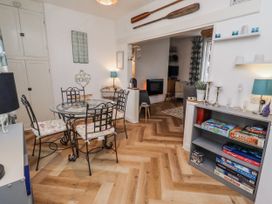 A dining room with a table and chairs at 55 Meldon terrace Newbiggin-by-the-Sea