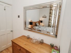 A bedroom with a bed and chest of drawers at 55 Meldon terrace Newbiggin-by-the-Sea