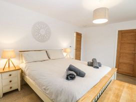 A bedroom with a bed and bedside tables at The Ivy in Norwich