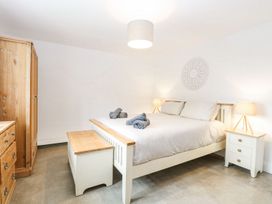 A bedroom with a bed and wardrobe at The Ivy in Norwich