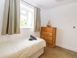 A bedroom with a bed and a chest of drawers at The Ivy in Norwich