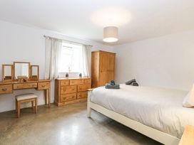 A bedroom with a bed and furniture at The Ivy in Norwich