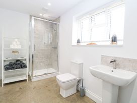 A bathroom with a shower, toilet, and sink at The Ivy in Norwich