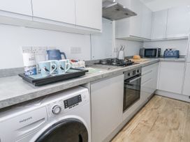 A kitchen with appliances and utensils at 8 Park View Grove in Weymouth