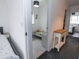 A bedroom with a bed and children toys at 8 Park View Grove in Weymouth