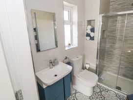A bathroom with a sink and shower at Doire Fhatharta Beag, Carraroe, County Galway