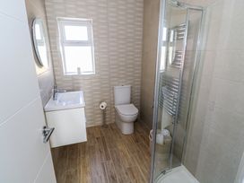 A bathroom with a toilet and shower at Doire Fhatharta Beag, Carraroe, County Galway