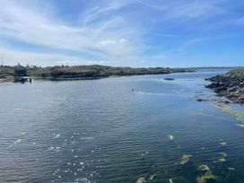A coastal view with water and rocks at Red House in Carraroe, County Galway