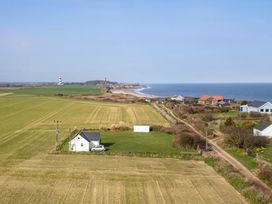 A coastal view with houses and fields at Seadrift near Happisburgh