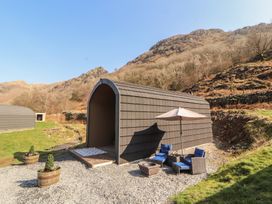 An outdoor glamping pod with seating area at Bluebelle - Crossgate Luxury Glamping Hartsop