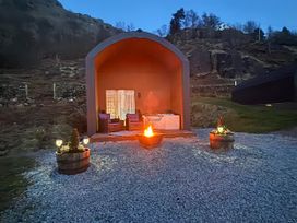 An outdoor area with a fire pit and seating at Bluebelle - Crossgate Luxury Glamping in Hartsop