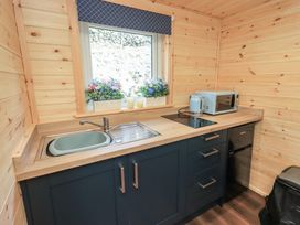 A kitchen with a sink and appliances at Bluebelle - Crossgate Luxury Glamping Hartsop