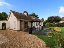 A house with a garden and patio at Barton Lodge in Porlock