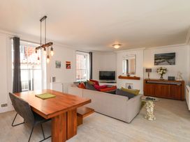 A living room with a sofa and dining table at The Four Views in Whitby