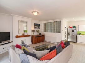 A living room with a sofa and television at The Four Views in Whitby