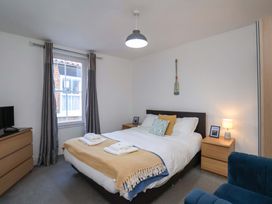 A bedroom with a bed and nightstand at The Four Views in Whitby