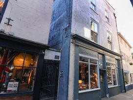 A storefront of Hildoceras at 12 with a window display at The Four Views in Whitby