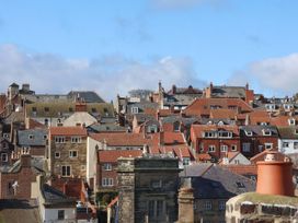 A view of rooftops and buildings at The Four Views in Whitby