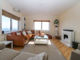 A living room with a sofa and coffee table at Snowdonia View in Pwllheli