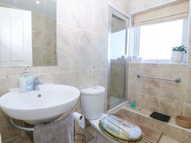 A bathroom with a sink and shower at Snowdonia View in Pwllheli
