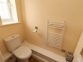 A bathroom with a toilet and towel rail at 35 Longbeach Drive