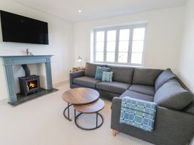 A living room with a sofa and coffee table at Ty Mawr Farm in Llanfairpwllgwyngyll