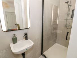A bathroom with a sink and shower at Ty Mawr Farm Llanfairpwllgwyngyll