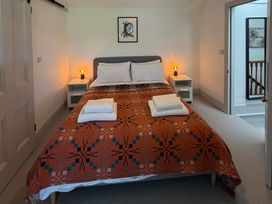 A bedroom with a bed and bedside tables at Ty Mawr Farm Penmynydd near Llanfairpwllgwyngyll