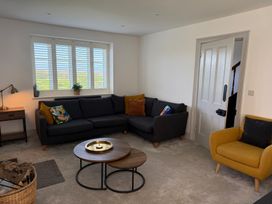 A living room with a sofa and coffee table at Ty Mawr Farm Penmynydd near Llanfairpwllgwyngyll