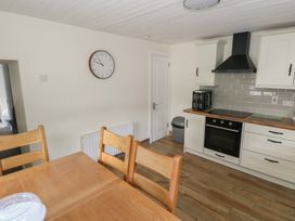 A kitchen with a table and chairs at Greenfield House Aughavas County Leitrim