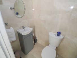 A bathroom with a toilet and sink at Greenfield House Aughavas, County Leitrim