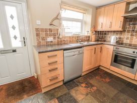 A kitchen with countertops and appliances at Shepherds Nook Chathill