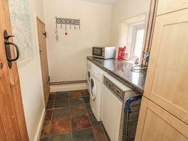 A utility room with a washing machine and dryer at Shepherds Nook in Chathill