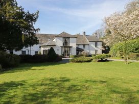 A house with a garden and trees at Plas Dolguog in Machynlleth