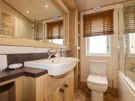A bathroom with a sink and toilet at 8 Summerleaze in Bude
