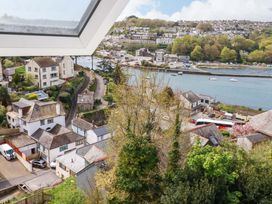 A view of houses and boats near water at Flat 5 in Looe